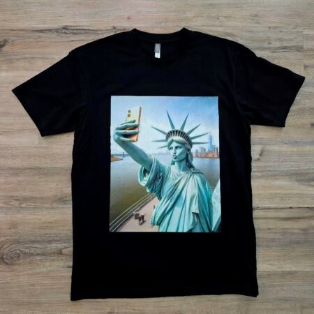 Liberty Selfie graphic t-shirt by SAVGE INK COLLECTIVE — bold Statue of Liberty design printed on black premium fabric