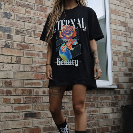 graphic t-shirt by SAVGE INK COLLECTIVE — playful portrait design printed on black premium fabric