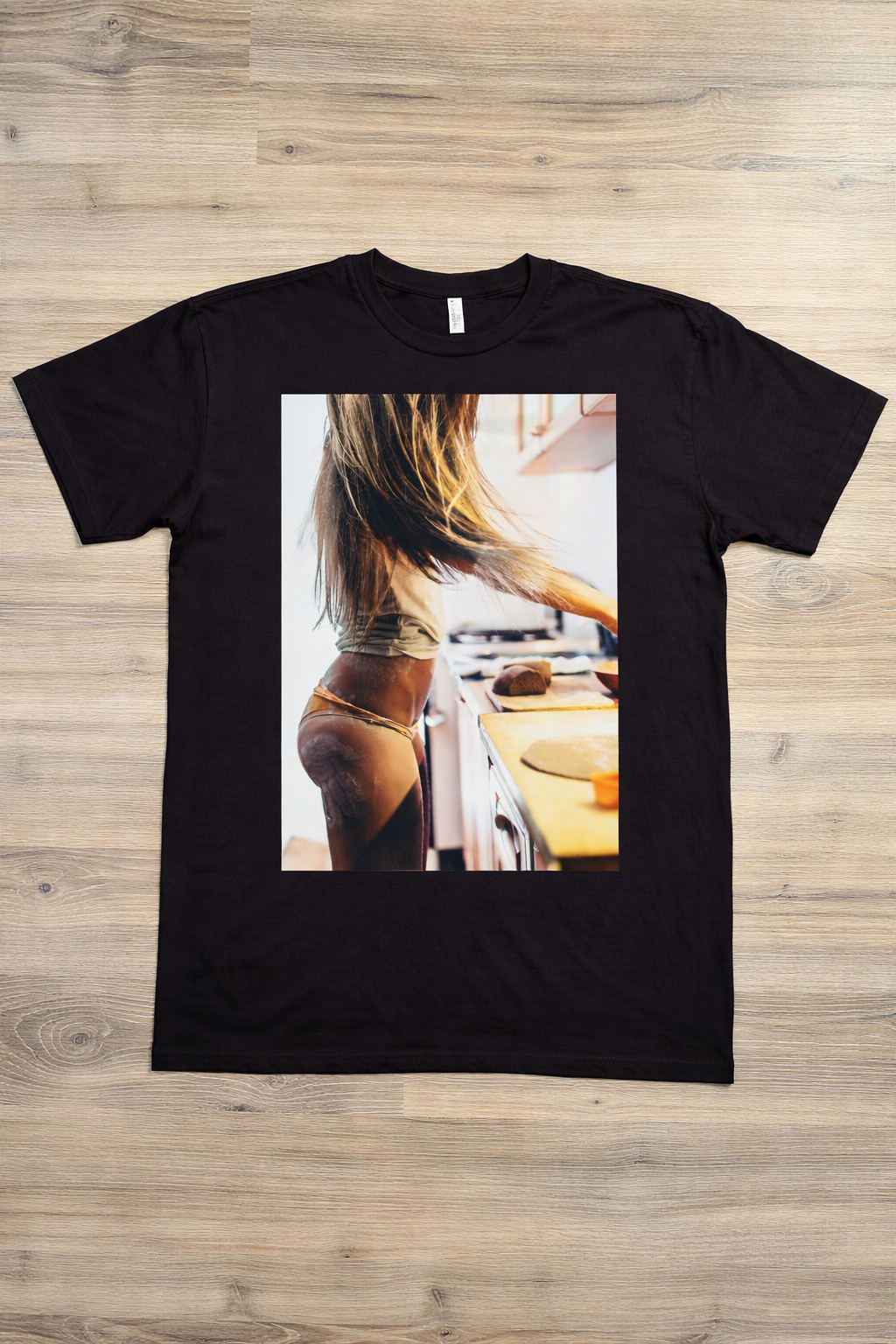 Baking Buns graphic t-shirt by SAVGE INK COLLECTIVE — bold provocative portrait design printed on black premium fabric